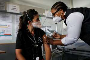After a slow start, South Africa's vaccination campaign has picked up speed and about 20 percent of adults are fully jabbed. By Phill Magakoe (AFP)