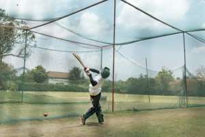 Aiming high: A young player takes a swing in the nets. By Tony KARUMBA (AFP)