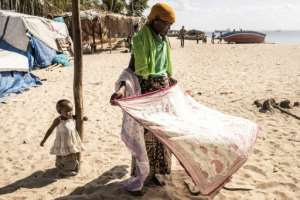 Almost daily, small boatloads of people arrive in Pemba from Palma district. By JOHN WESSELS (AFP)