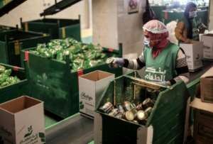 Almost one third of Egypt's more than 100 million people live below the poverty line and survive on less than $2 a day and due to jobs lost because of the coronavirus pandemic food banks have been giving people handouts. By Mohamed el-Shahed (AFP/File)