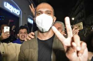 Algerian journalist Khaled Drareni, pictured here on February 19, 2021, after his release from prison.  By RYAD KRAMDI (AFP)