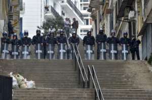Algerian police have recently been deploying to stop anti-government demonstrations, as seen in this picture from Algiers taken on March 30. By RYAD KRAMDI (AFP)