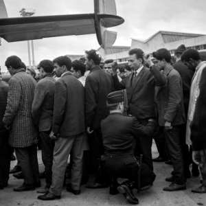 Algerians arrested during the demonstration in Paris on October 17, 1961 are searched before boarding a plane bound for Algeria. By - (AFP)