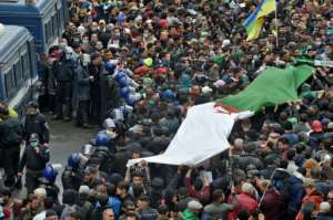 Algerians rally in the capital Algiers on February 22, 2021, marking the second anniversary of the country's Hirak anti-government protest movement. By RYAD KRAMDI (AFP)