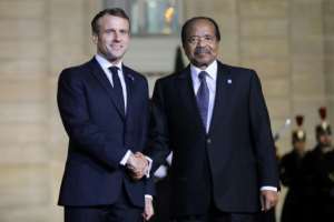 Allies: French President Emmanuel Macron welcomes Cameroonian President Paul Biya at the Elysee Palace. By LUDOVIC MARIN (AFP)