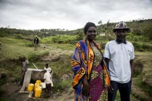 Although the search for justice continues with Rwanda determined to chase down key suspects, reconciliation is the path chosen by Jean-Claude Mutarindwa, a Hutu, and Daphrosa Mukarubayize, a Tutsi, seen in the valley separating their villages. By JACQUES NKINZINGABO (AFP/File)