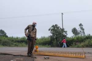 An armed police officer monitors vehicles and pedestrians on the outskirts of Nairobi. By Kabir Dhanji (AFP)