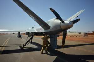 An armed Reaper drone is checked before take off at a French base in Niger, which is part of the French anti-jihadist force Barkhane.  By Daphné BENOIT (AFP)