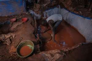 An artisanal miner pans for gold in the Luhihi gold mine. By Guerchom NDEBO (AFP)