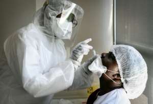 An elderly home worker is tested for novel coronavirus near Paris. By ALAIN JOCARD (AFP)