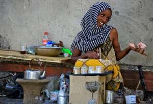 An Ethiopian refugee who fled the fighting in Tigray sells tea in Village 8 in Gedaref State, eastern Sudan. By ASHRAF SHAZLY (AFP)