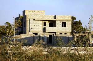 An illegal construction project is pictured in Benghazi, where entire informal neighbourhoods have sprung up in outlying areas zoned for farming, with no building permits and no masterplan. By Abdullah DOMA (AFP)