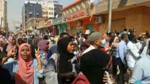 An image grab taken from AFP TV on January 17, 2019, shows people chanting and shouting during a protest calling for the resignation of Sudanese President Omar al-Bashir in the capital Khartoum.  By Linda ABI ASSI (AFP)