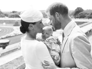 An official christening photo released by Prince Harry and his wife Meghan, holding their baby son, Archie at Windsor Castle. By Chris ALLERTON (SUSSEXROYAL/AFP/File)