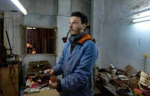 Anis Bouchnak learnt the pipe-making skills from an expert employed by his grandfather, who died last year. By FETHI BELAID (AFP)