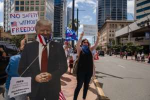 Anti-lockdown protests in several US states drew hundreds of people. By ARIANA DREHSLER (AFP)