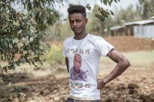 Asaminew, emblazoned on Sisay's T-shirt, is an icon of Amhara nationalism. By EDUARDO SOTERAS (AFP/File)