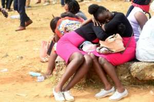 Applicants sleep as they wait to obtain national identity numbers in the Lagos state capital of Ikeja. By PIUS UTOMI EKPEI (AFP)