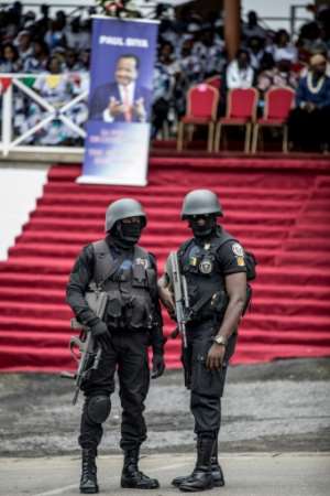 Armed police on duty at a party political meeting in the troubled west of Cameroon. By MARCO LONGARI (AFP/File)