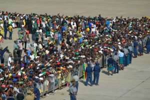 Around two thousand supporters, family members and government officials were on the tarmac at Harare airport to welcome Mugabe's remains. By TONY KARUMBA (AFP)