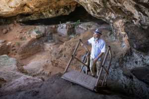 Archeologists walk to enter the cave, scene of the latest significant archaeological finding in Morocco. By FADEL SENNA (AFP)