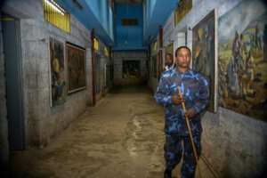 Artwork depicting scenes from Ethiopian history line a corridor at the torture facility. By MICHAEL TEWELDE (AFP)