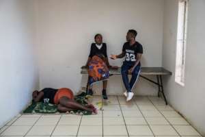 At least 12 people have been killed in the violence, which has been directed against economic migrants. By Michele Spatari (AFP)
