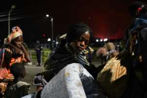 At least 3,000 people had arrived in neighbouring Rwanda, according to the country's national broadcaster. By Simon Wohlfahrt (AFP)