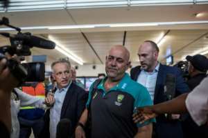 Australia coach Darren Lehmann is mobbed by media on arrival in Johannesburg Tuesday