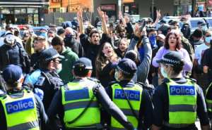 Australian police arrested dozens at an anti-lockdown rally in Melbourne on Sunday after crowds defied stay-at-home orders. By William WEST (AFP)