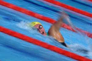 Australia's Ariarne Titmus, 17, won her third gold medal on the final night of the swimming competition.