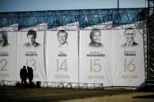 Banners depicting former US president Barack Obama, right, and other speakers who have given the Nelson Mandela Annual Lecture.  By MARCO LONGARI (AFP)