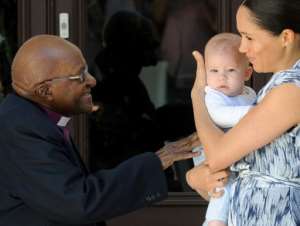 Baby face: Archie captured the headlines on Wednesday when Harry and his wife Meghan introduced him to South Africa's anti-apartheid campaigner Archbishop Desmond Tutu and his wife Leah. By HENK KRUGER (POOL/AFP)