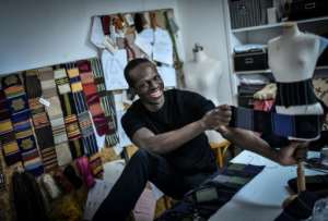 Back to his roots: Fashion designer Imane Ayissi is on a mission to use indigenous African materials in elite Paris haute couture. By STEPHANE DE SAKUTIN (AFP)