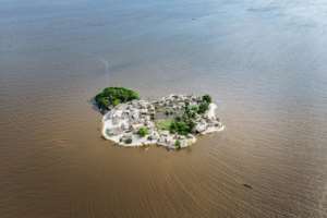 'Bakery Island,' where the waters of the Congo mingle with the Atlantic. Only members of the Assolongo tribe are allowed to live in the mangrove park. By ALEXIS HUGUET (AFP)