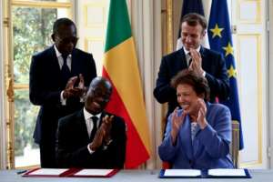 Benin President Patrice Talon and Culture Minister Jean-Michel Abimbola travelled to Paris to bring home the artefacts that were snatched by French forces 130 years ago. By SARAH MEYSSONNIER (POOL/AFP)