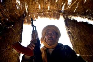Bechir Mohamed, the chief of security in the Al-Mahbes area in the Western Sahara poses for a photo inside his hut on February 3, 2017