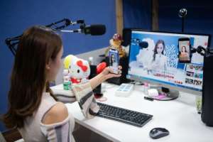 Beijing-based Qiao Xi live-streams songs, dance moves and observations about her daily life to some 600,000 followers.  By Nicolas ASFOURI (AFP)