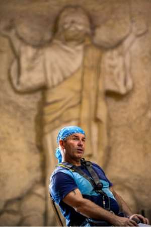 In addition to sculpture, Mario gives a high rope sport lesson to the monastery. By Mohamed el-Shahed (AFP)