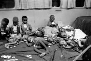 Biafran children sit in a plane chartered by the International Red Cross (ICRC) and humanitarian organisation