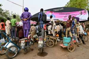 Bike boost: supporters stand on their motorcycles for a better view during a campaign rally in Bazoum.  By Issouf SANOGO (AFP)