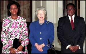 Britain's Queen Elizabeth II with President Robert Mugabe of Zimbabwe and his wife, Grace, sfter visiting Buckingham Palace in 1997