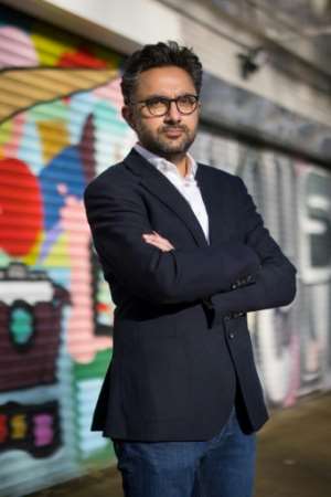 British author Sathnam Sanghera calls Robert Clive's statue `` degrading '' outside the Foreign, Commonwealth and Development Office in central London.  By TOLGA AKMEN (AFP)