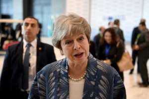 British Prime Minister Theresa May said she was still discussing with the EU possible amendments to the Brexit deal's arrangements for the Irish border. By Khaled DESOUKI (AFP)