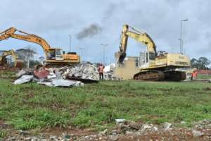 Bulldozers are still cleaning up the wreckage almost three weeks later.  By - (AFP)