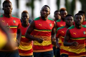 Cameroon's players run during a training session in Libreville on February 4, 2017, on the eve of the 2017 Africa Cup of Nations final against Egypt