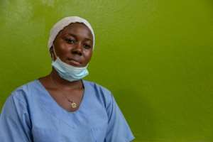 Carer: Noura Mfagwen, 23, a worker at the home. By Daniel Beloumou Olomo (AFP)
