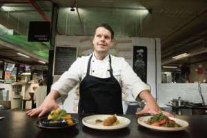 Chef Mario Barnard works with Mopane worms, a traditional snack in South Africa. By RODGER BOSCH (AFP)