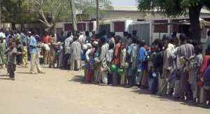 Child beggars queue for food in a rich neighbourhood of Kano. By AMINU ABUBAKAR (AFP/File)