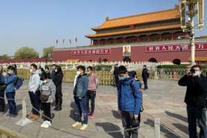 China, which appears to be over the worst of its outbreak, on Saturday held a national day of mourning for its dead -- well over 3,000 people. By LEO RAMIREZ (AFP)